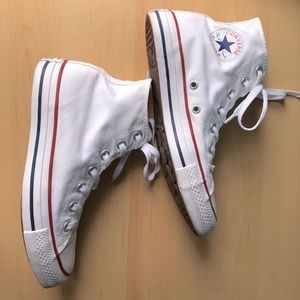 White hightop all-star converse.